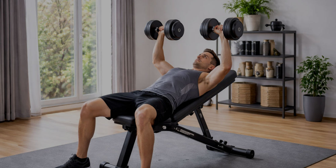 Man exercising with dumbbells on a bench in a home setting

