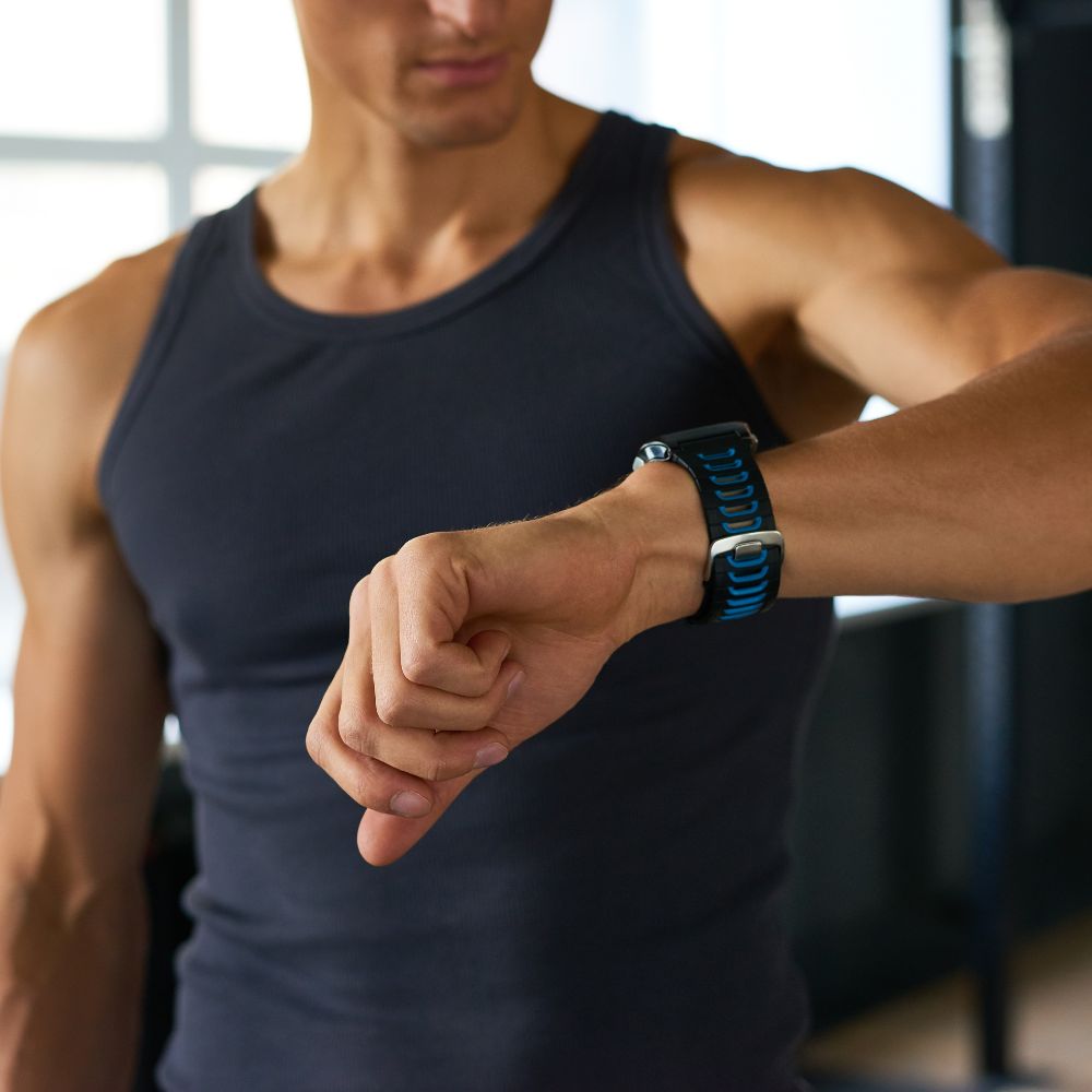 Man checking smartwatch on wrist